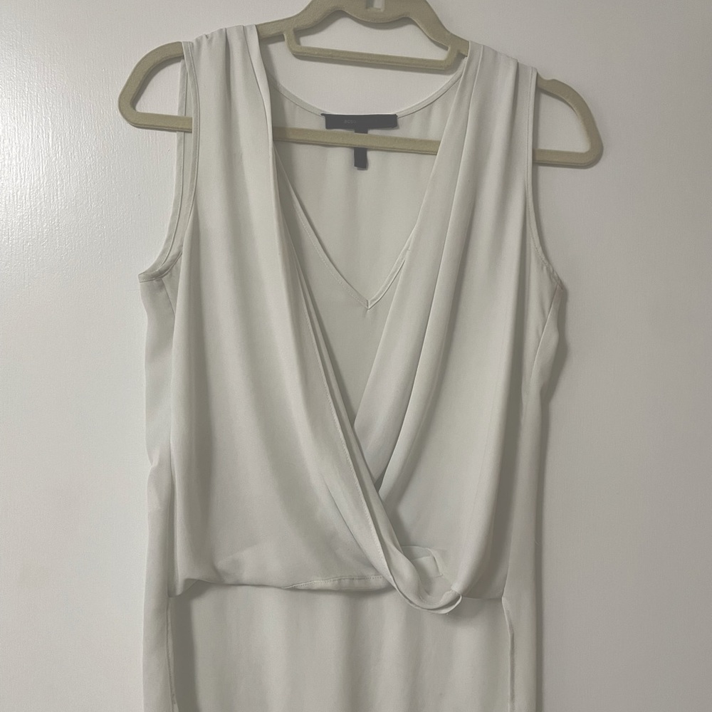 BCBG white short sleeve blouse with long back- XS